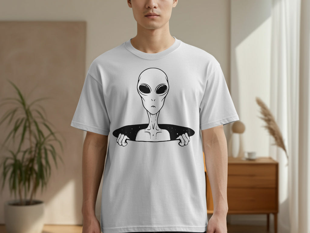White t-shirt with black graphic of an alien peeking out from a portal.