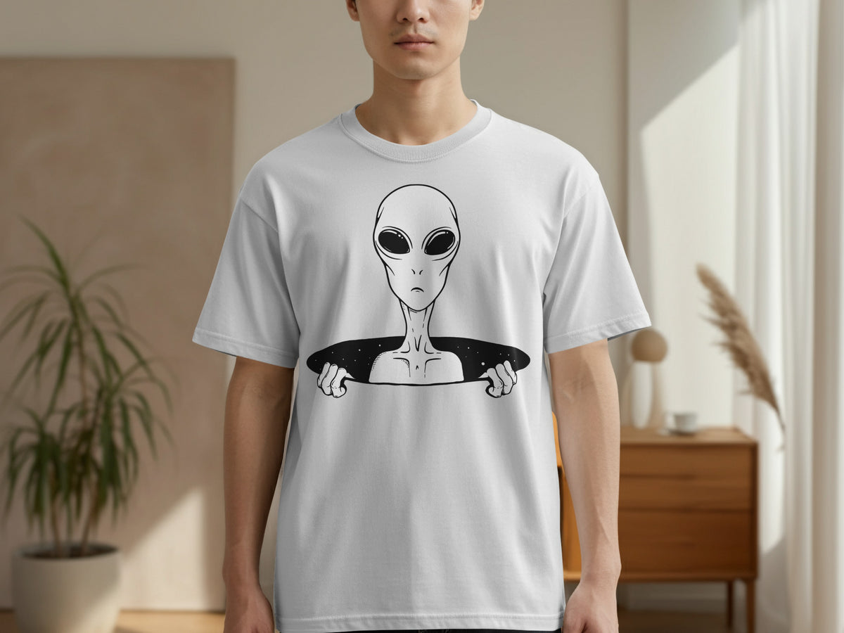 White t-shirt with black graphic of an alien peeking out from a portal.