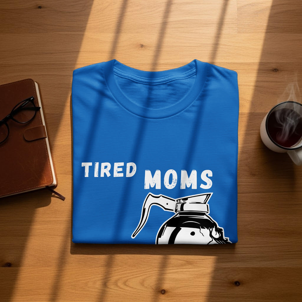 Blue t-shirt with "TIRED MOMS" text and a coffee pot graphic.