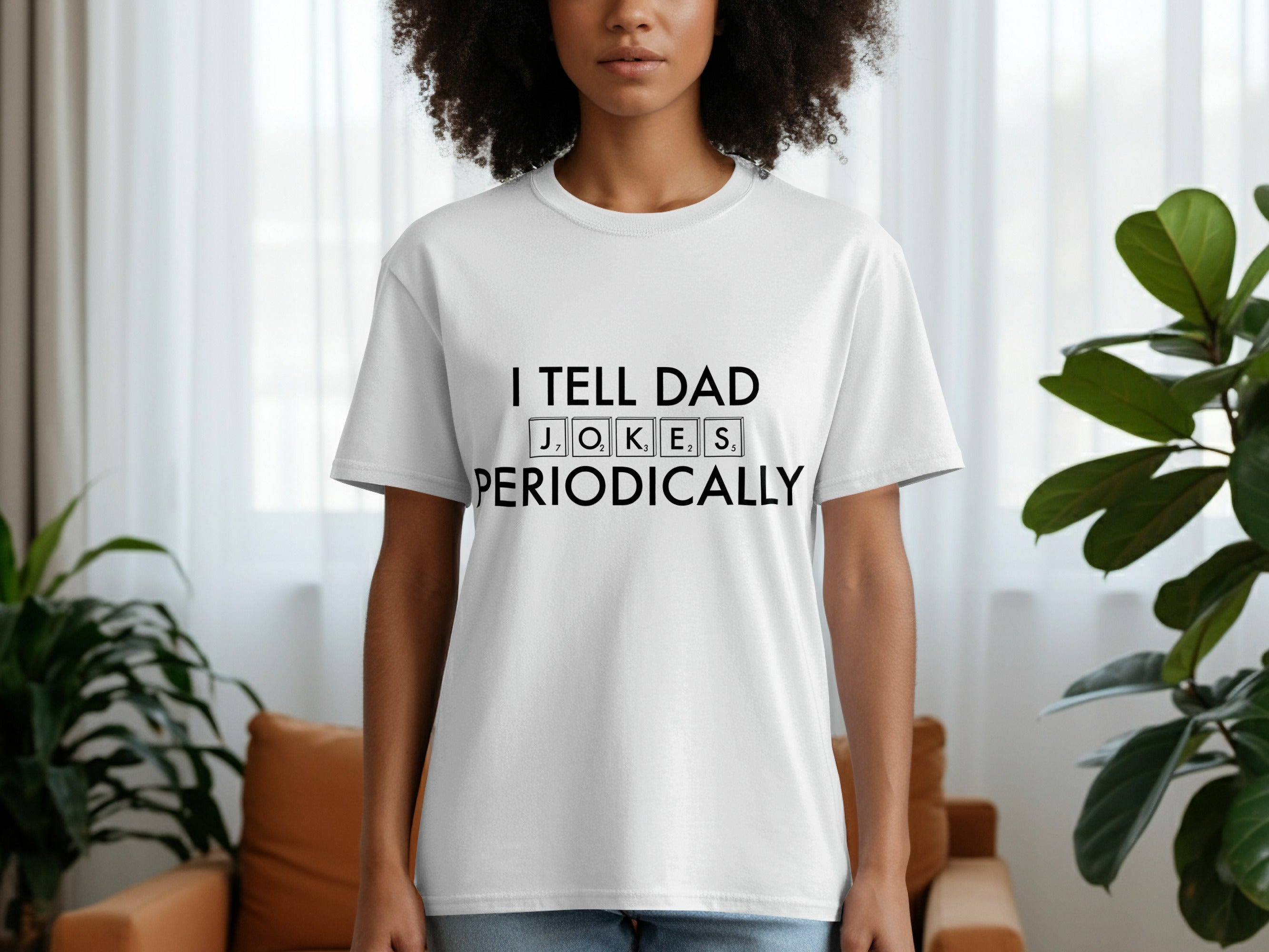 White t-shirt with black text reading "I TELL DAD PERIODICALLY" and Scrabble tiles for JOKES.