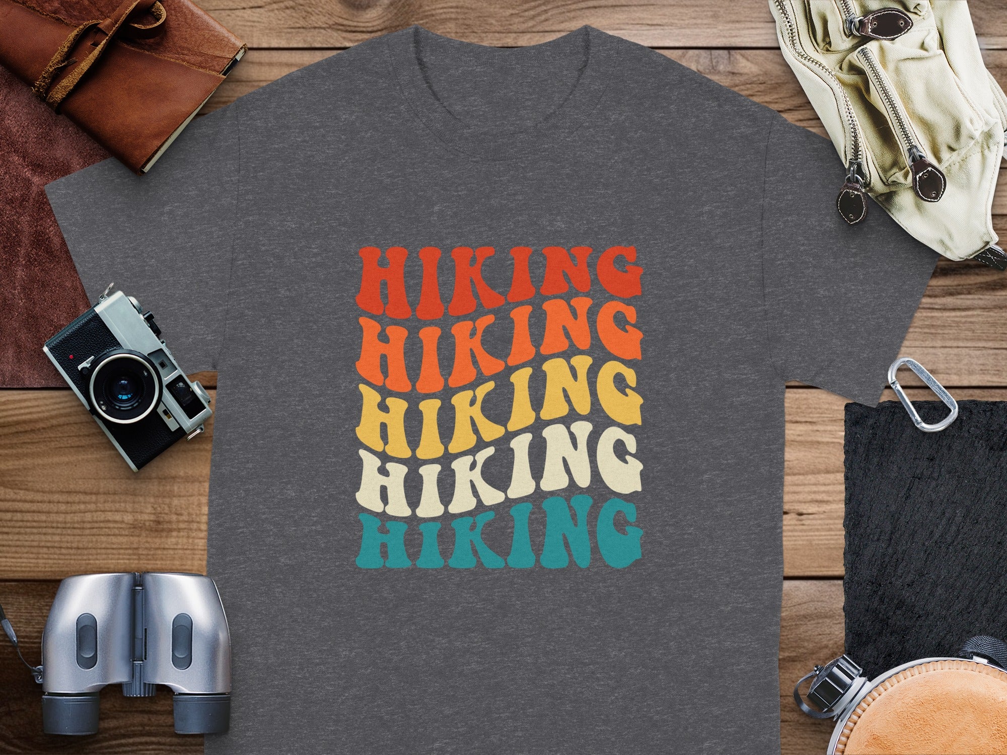 Dark gray t-shirt with stacked "Hiking" text in retro colors.