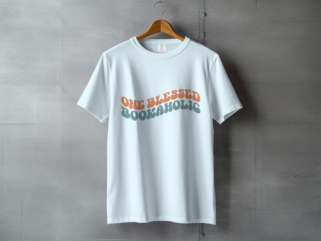 White t-shirt with retro text reading "ONE BLESSED BOOKAHOLIC".