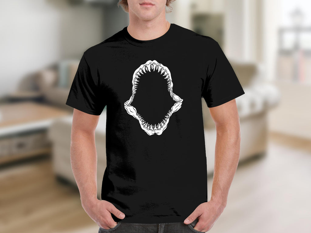 Black t-shirt with white shark jaws graphic on the chest.
