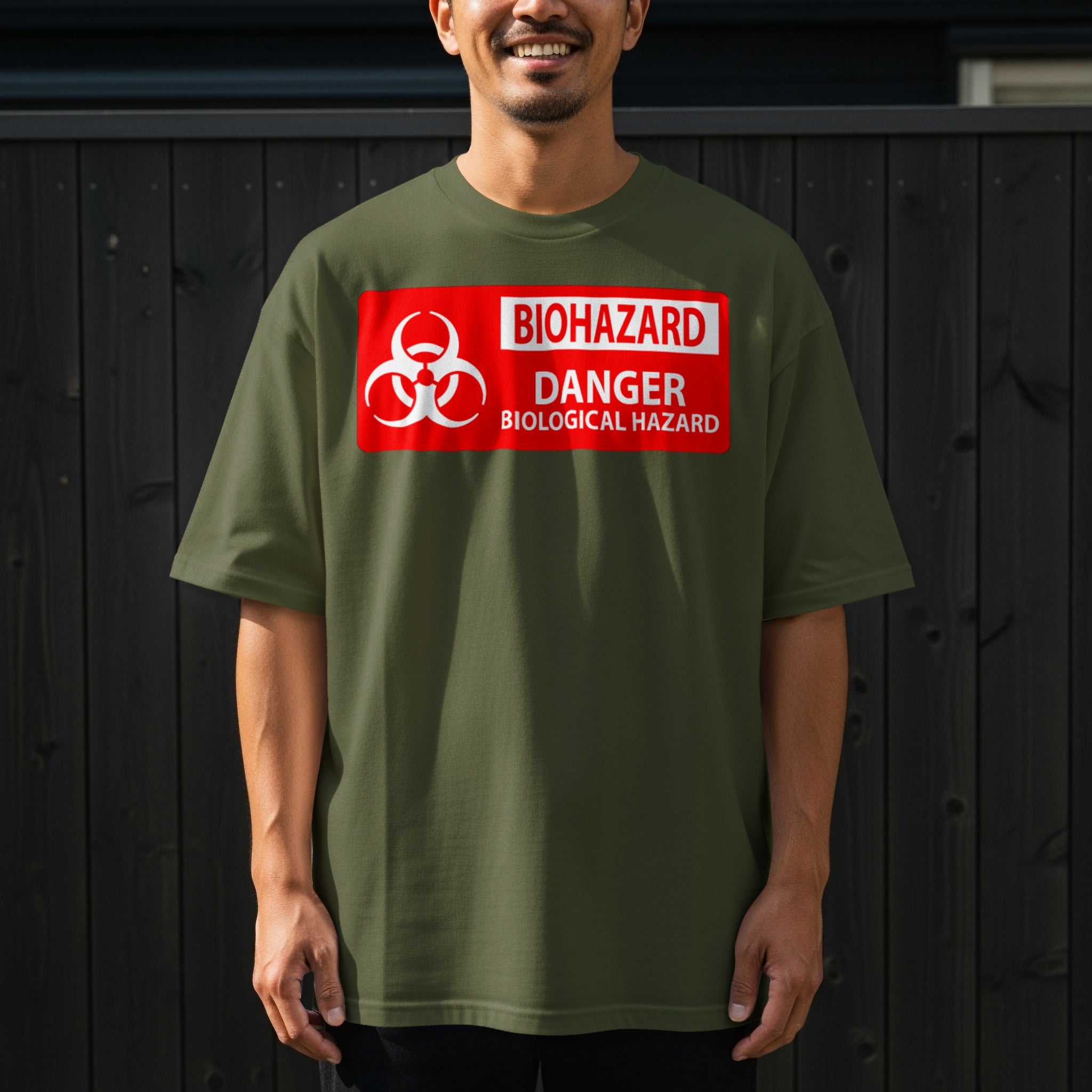 Olive green t-shirt with a red biohazard danger biological hazard warning sign graphic.