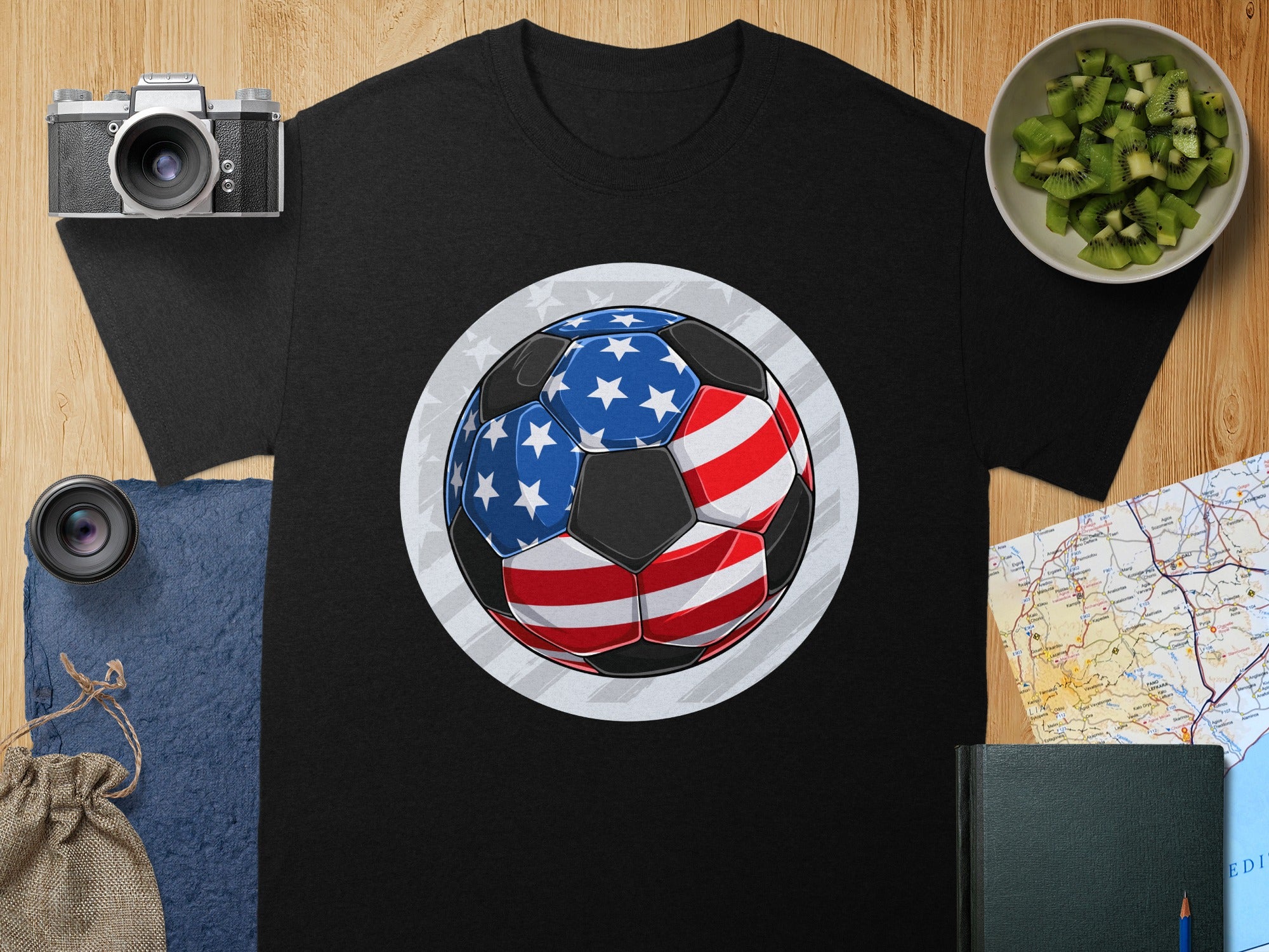 Black t-shirt with a soccer ball design featuring the American flag pattern.