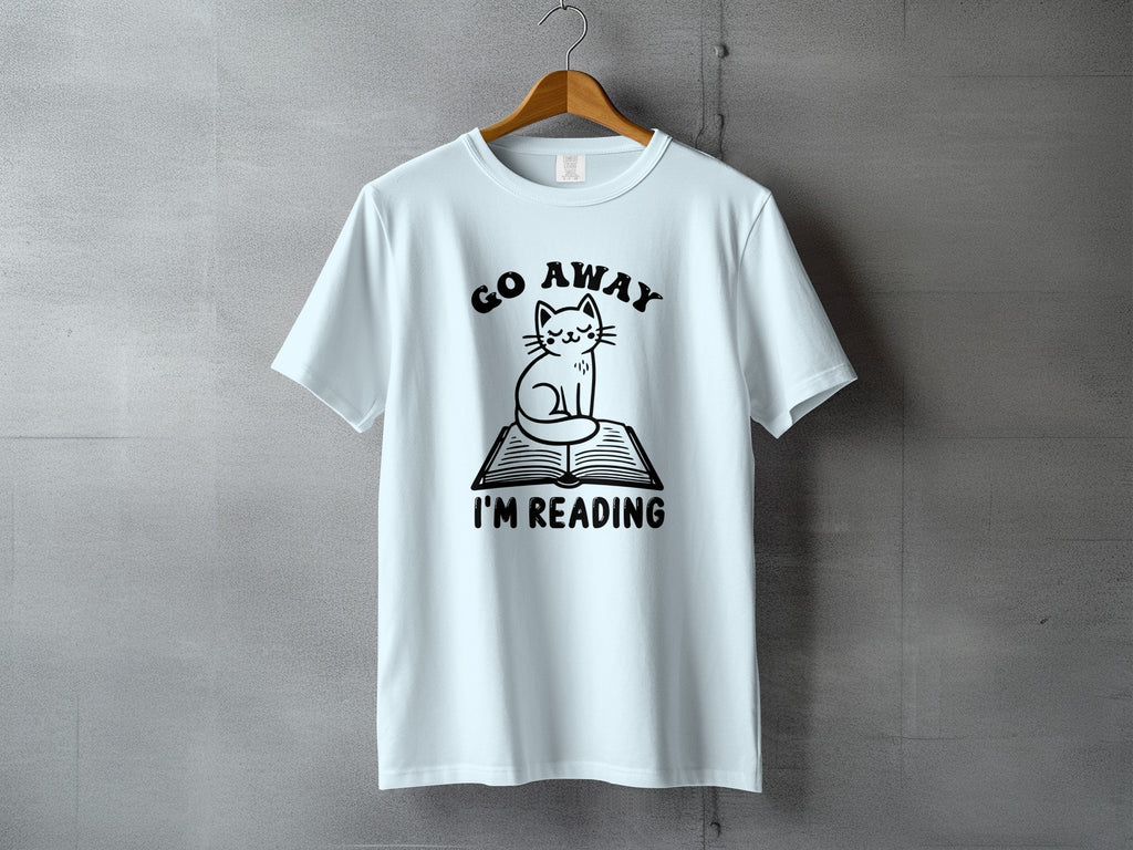 Light blue t-shirt with black graphic text "GO AWAY I'M READING" and a cat on a book.