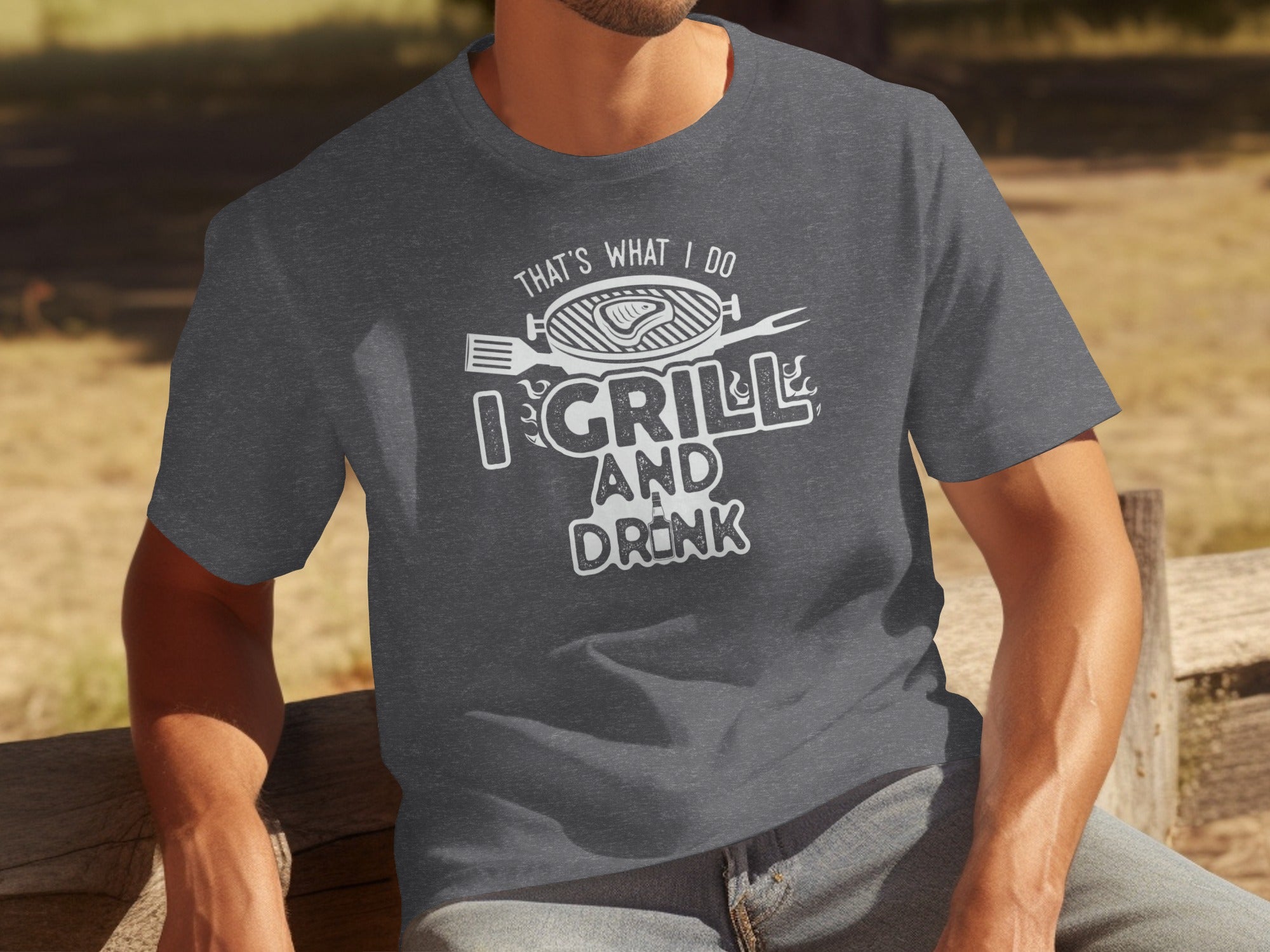 Dark grey t-shirt with white text "That's what I do I grill and drink."