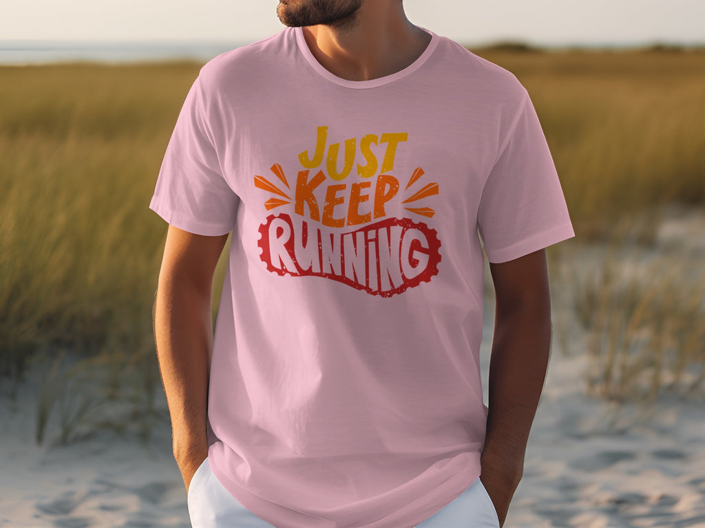 Pink t-shirt with "JUST KEEP RUNNING" graphic in orange and red text.