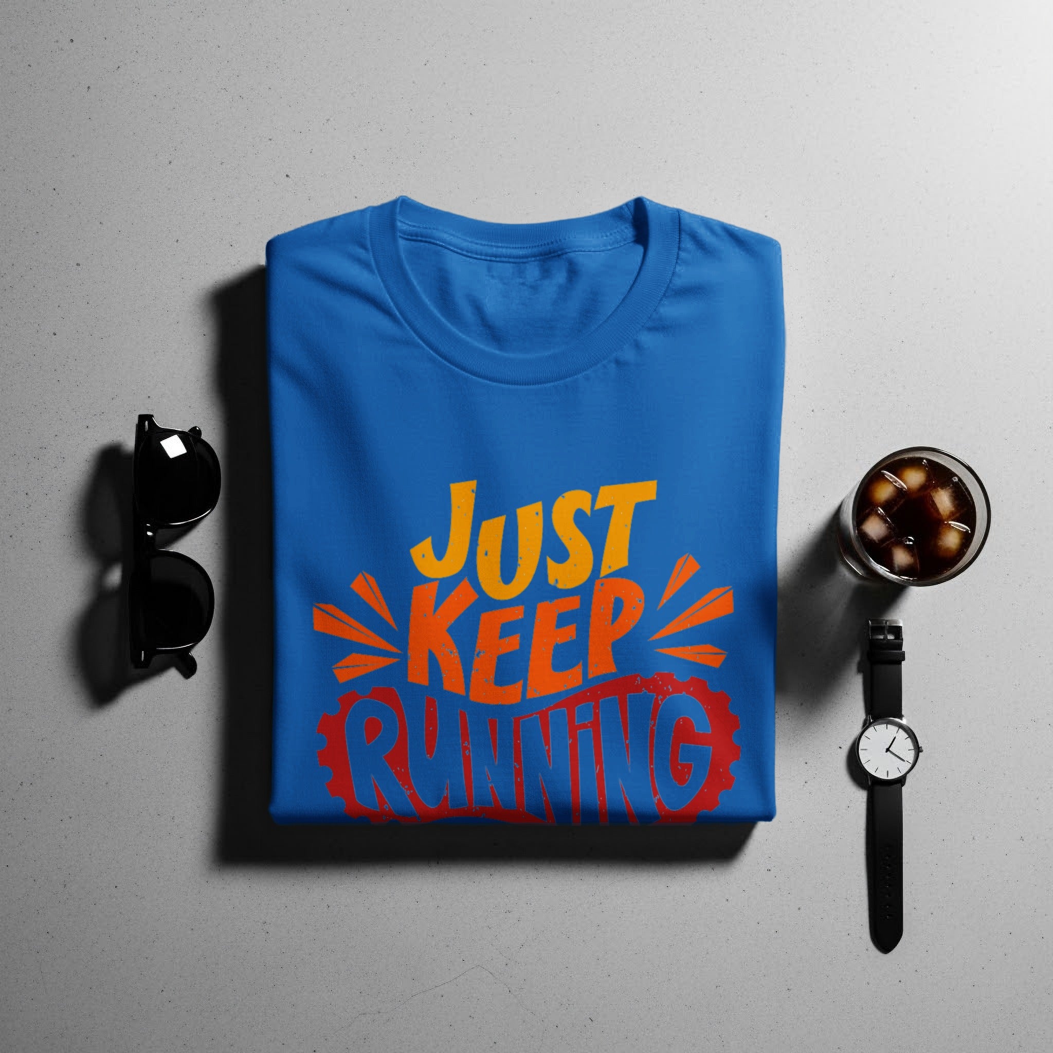 Blue t-shirt with "JUST KEEP RUNNING" orange and red distressed lettering.