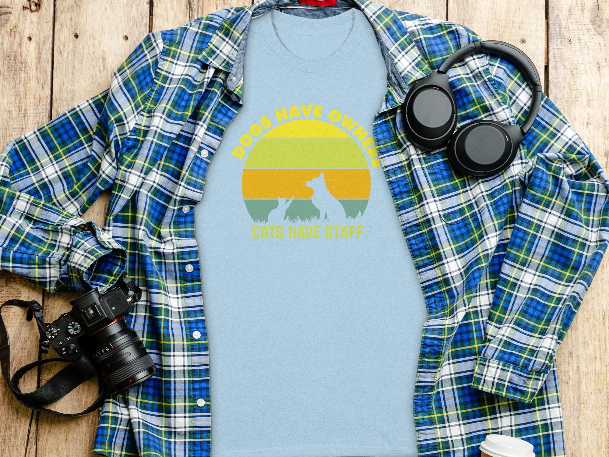 Light blue t-shirt with "DOGS HAVE OWNERS CATS HAVE STAFF" text and pet silhouettes.