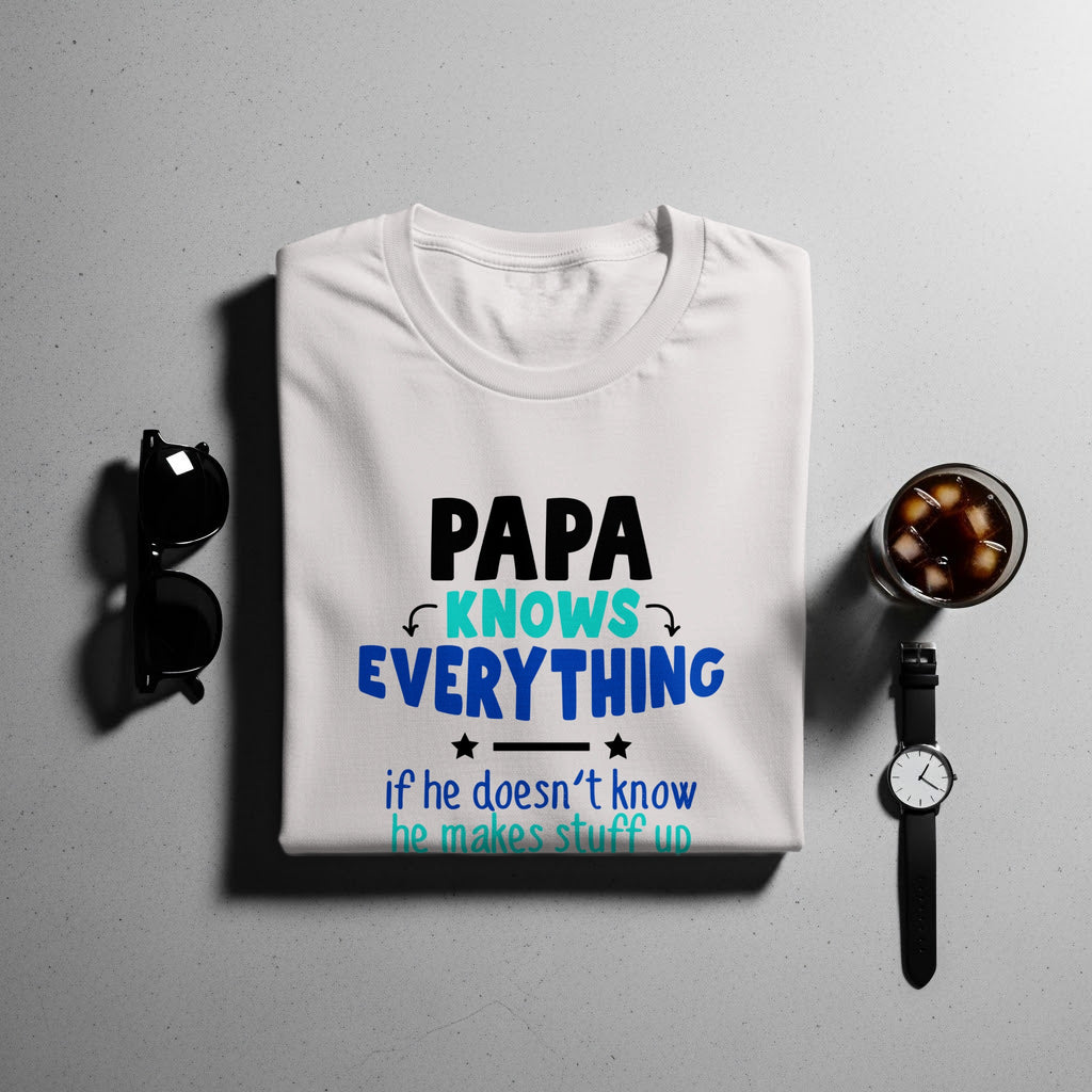 White t-shirt with text "PAPA KNOWS EVERYTHING if he doesn't know he makes stuff up."