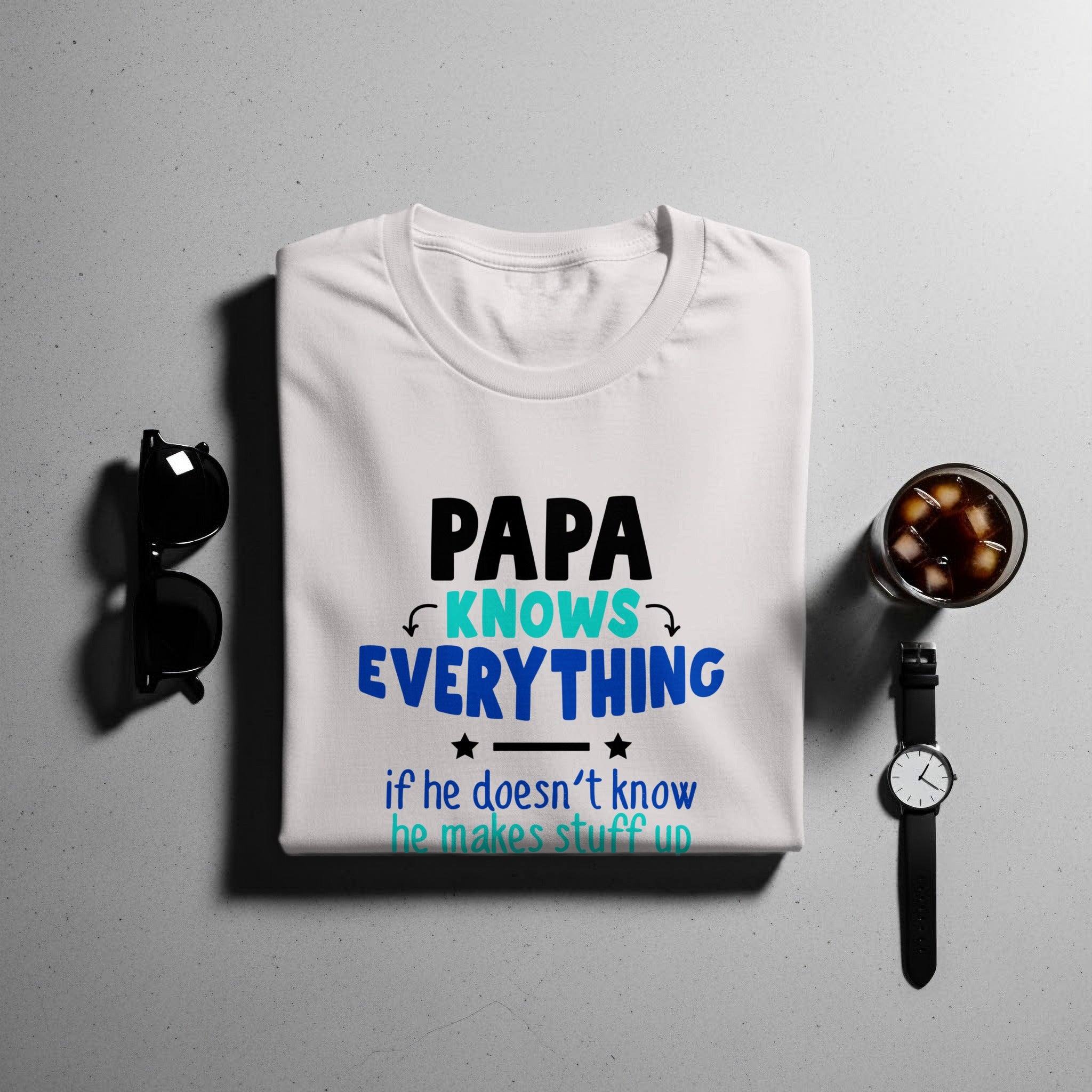 White t-shirt with text "PAPA KNOWS EVERYTHING if he doesn't know he makes stuff up."