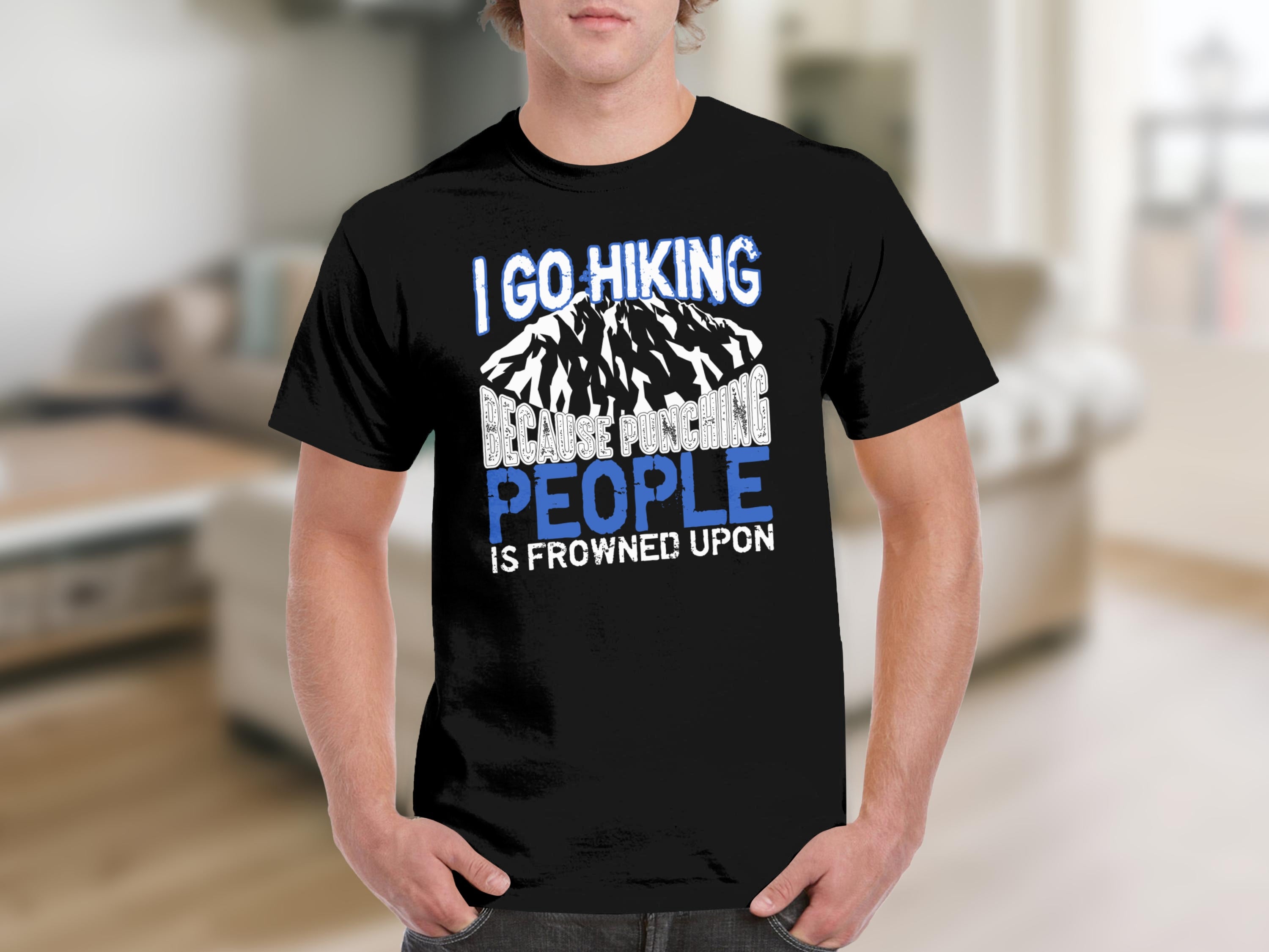 Black t-shirt with text "I GO HIKING BECAUSE PUNCHING PEOPLE IS FROWNED UPON."