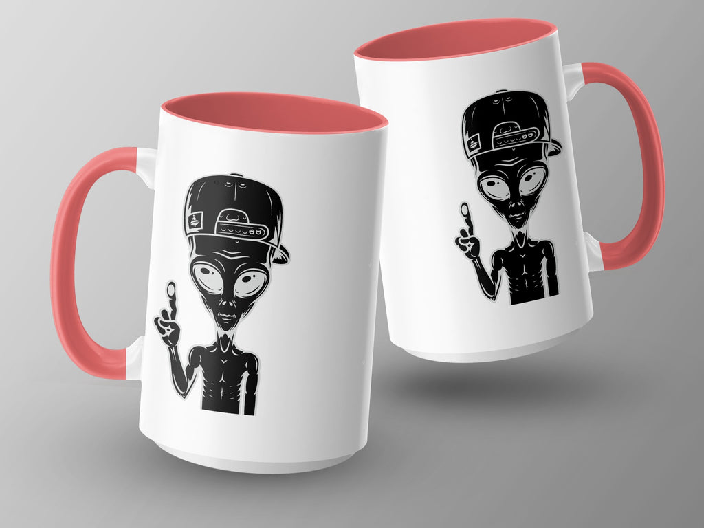 Two white mugs with pink interiors and handles featuring alien designs.
