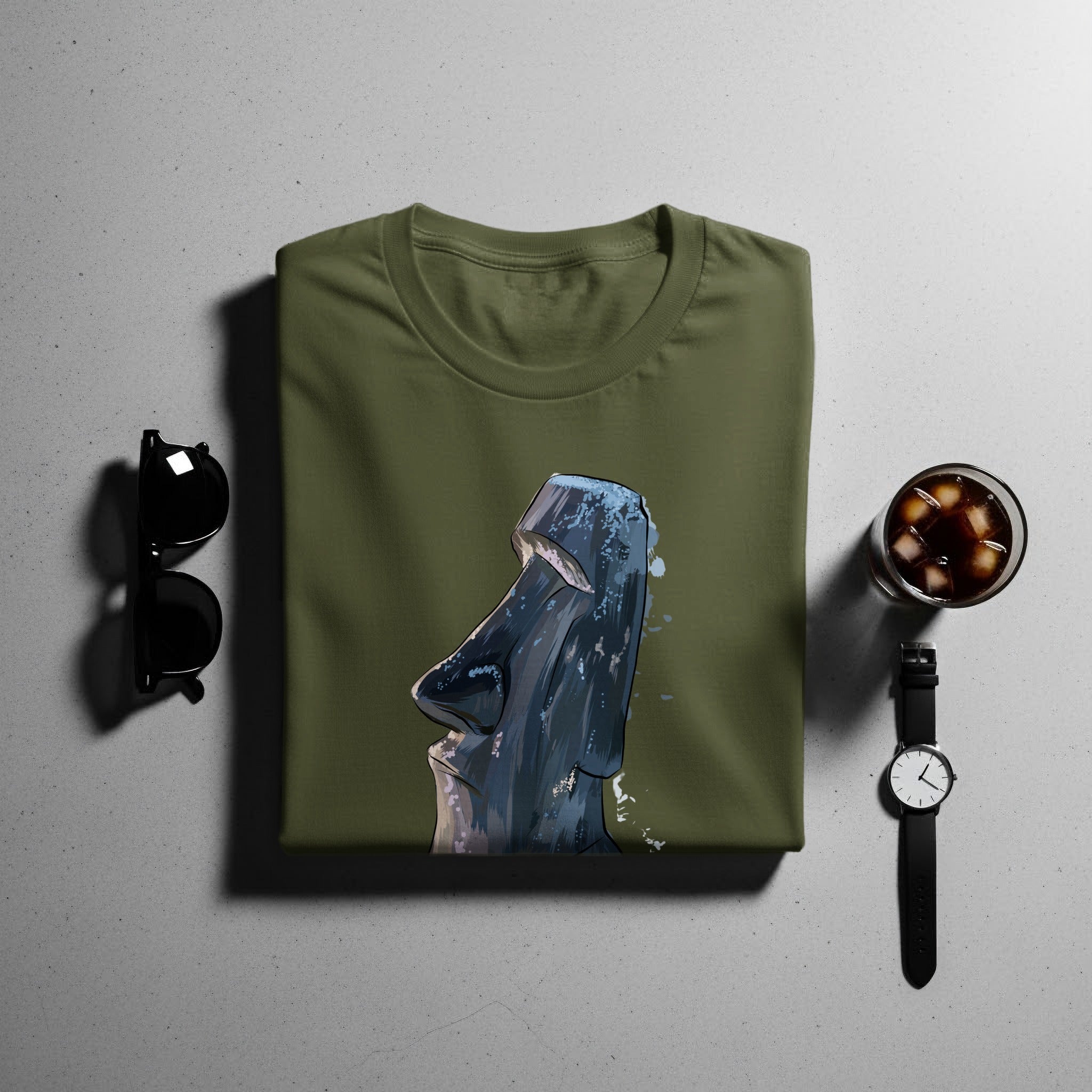 Olive green t-shirt with a graphic of a Moai statue.