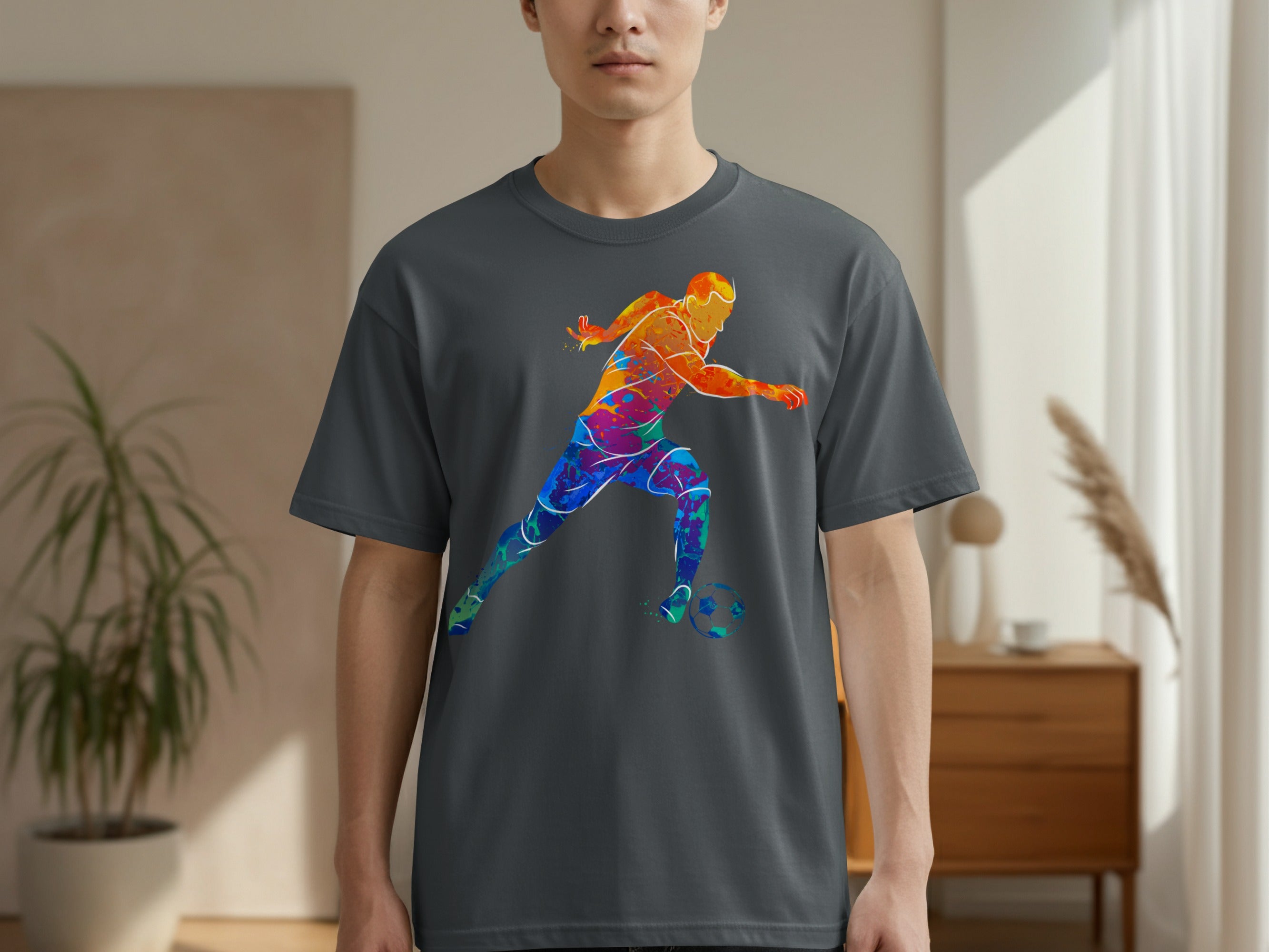 Dark grey t-shirt with a vibrant, abstract watercolor soccer player design.
