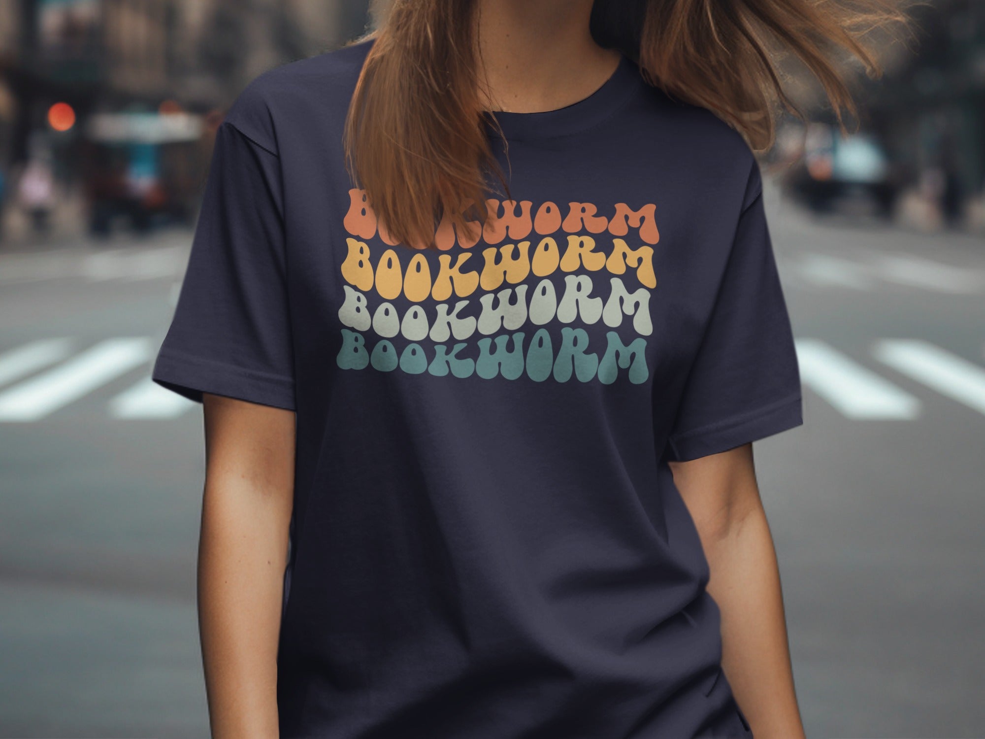 Navy t-shirt with "BOOKWORM" text in groovy font and pastel colors.