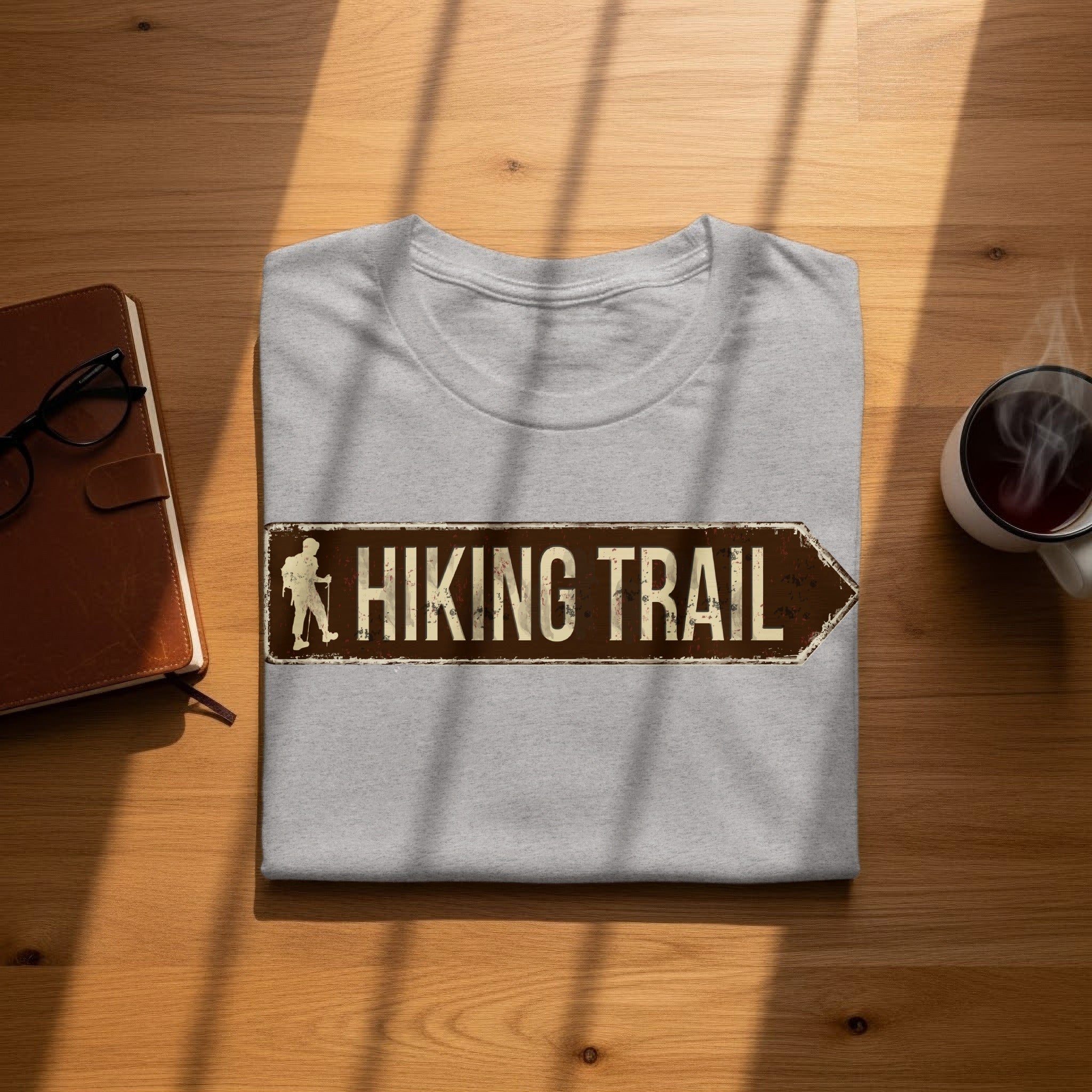 Grey t-shirt with a distressed "Hiking Trail" sign graphic pointing right.