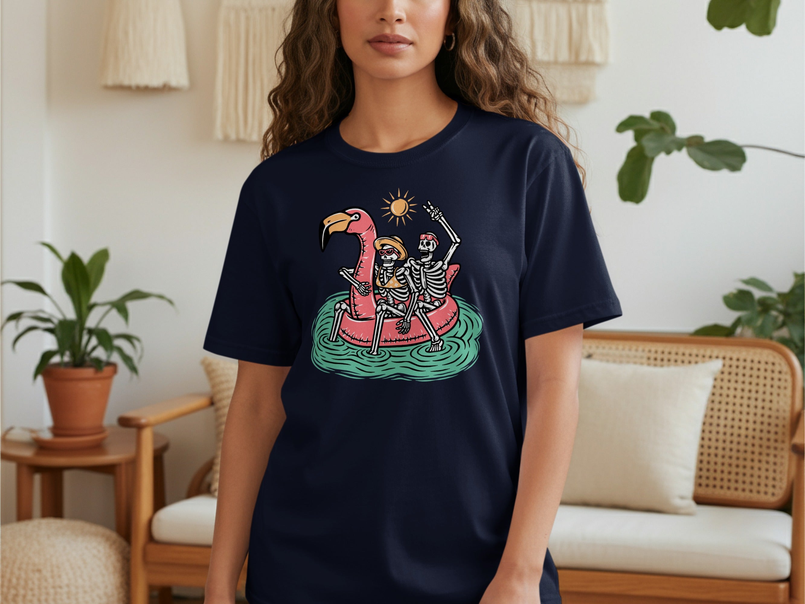 T-shirt with skeleton couple on flamingo float.