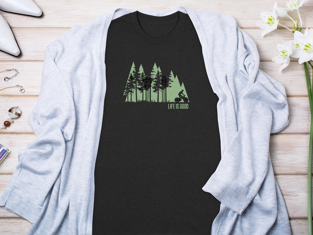 Dark t-shirt with a forest and cyclist graphic, and "LIFE IS GOOD" text.
