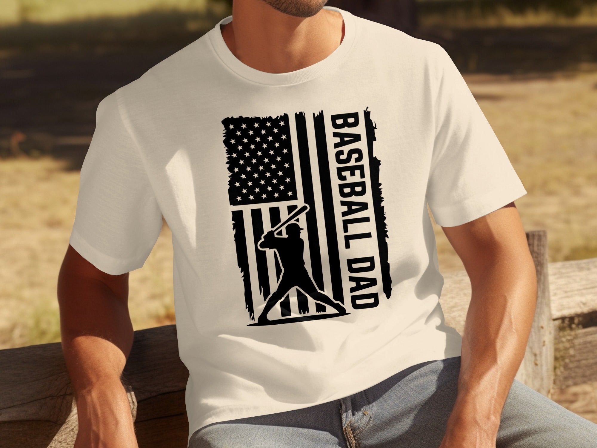 White t-shirt with black graphic of baseball player silhouette and "BASEBALL DAD" text.