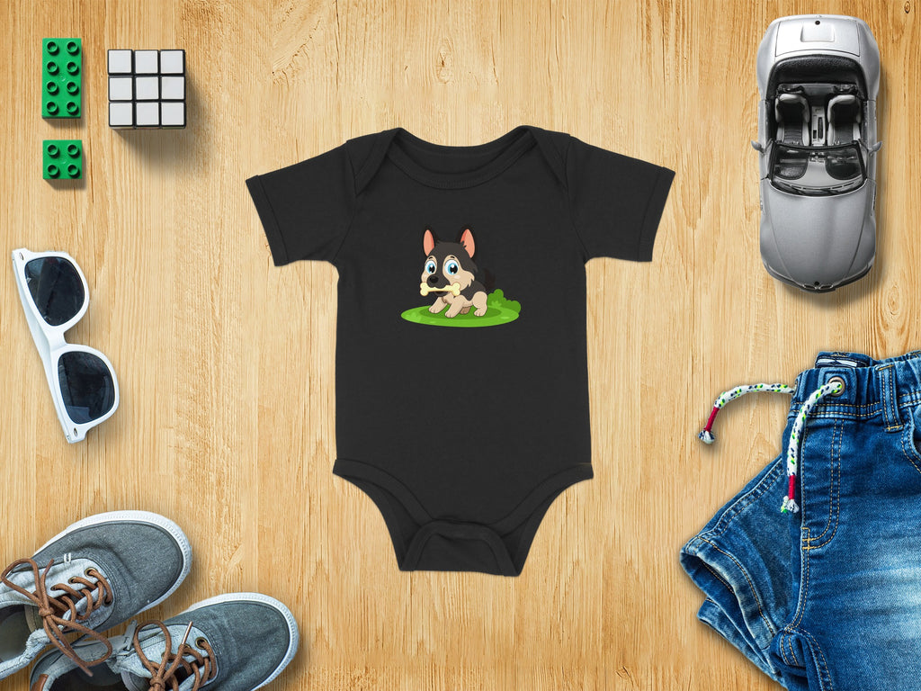 Black baby bodysuit with cartoon dog on grass.
