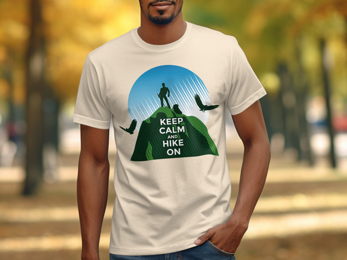 Cream t-shirt with hiker, mountain, birds, and text "KEEP CALM AND HIKE ON".