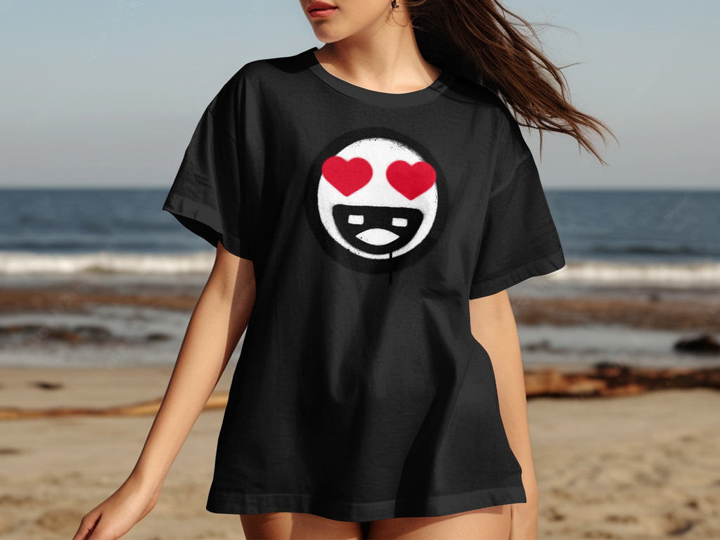 Black t-shirt with a graphic of a character's face with red hearts for eyes.