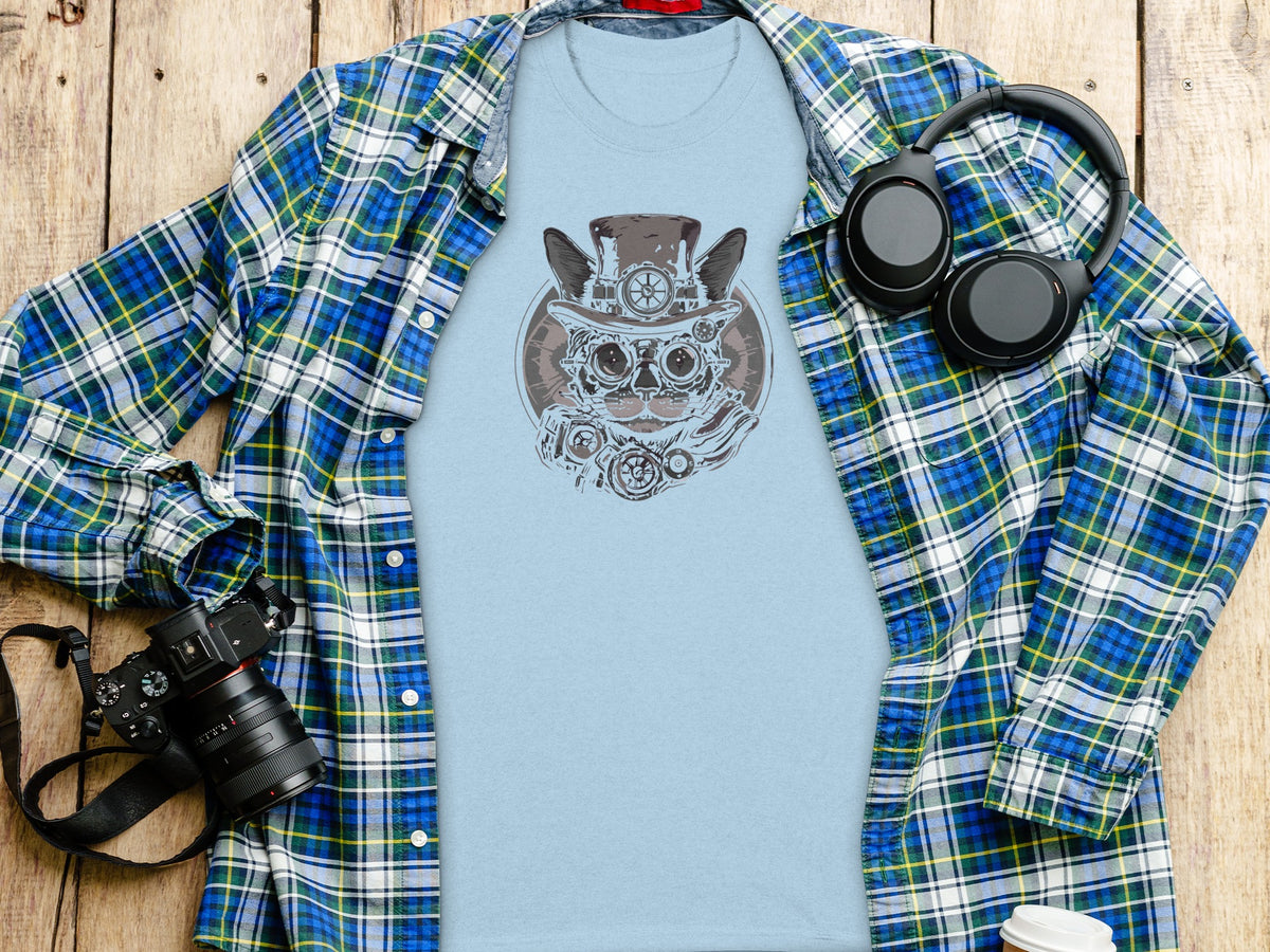 Light blue t-shirt with steampunk cat graphic, open plaid shirt, headphones, and camera.
