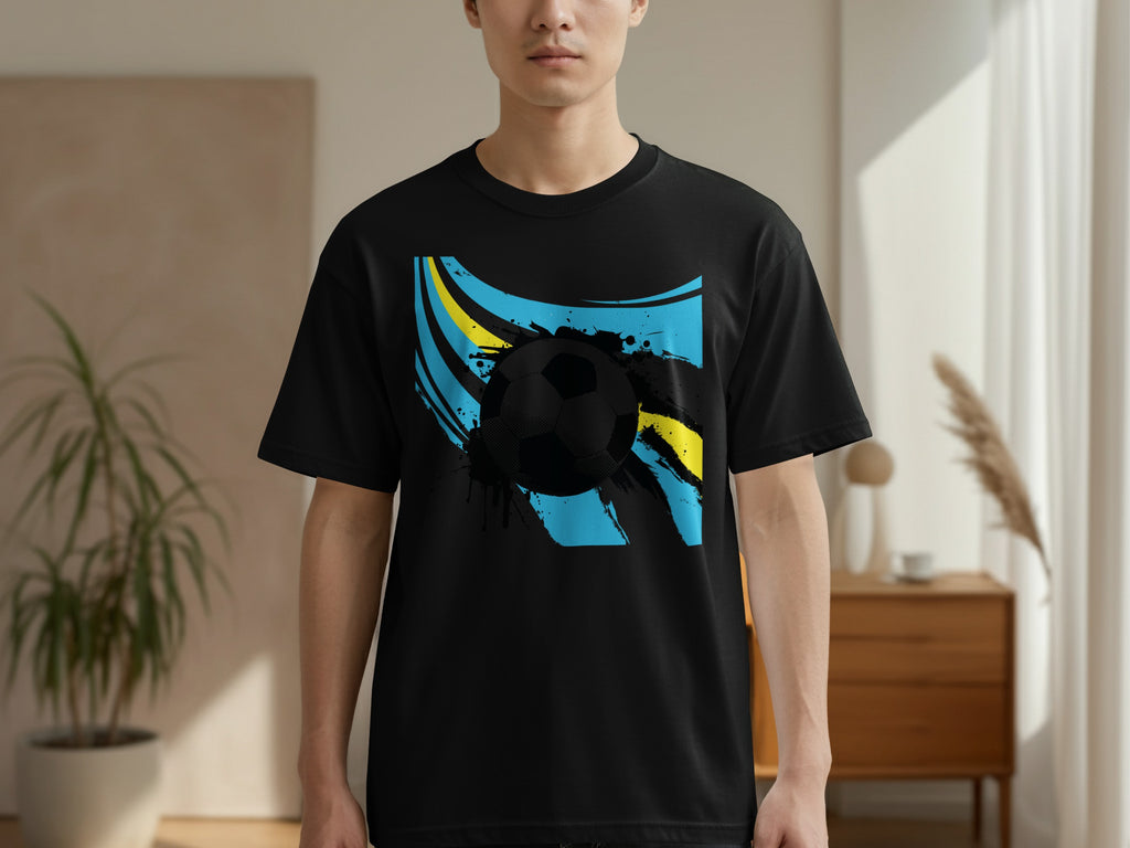 Black t-shirt with a soccer ball and splashes of blue and yellow.