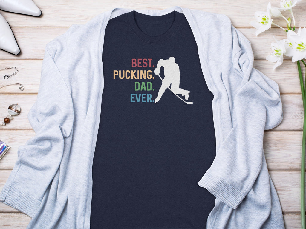 Navy t-shirt with "Best. Pucking. Dad. Ever." text and hockey player graphic.