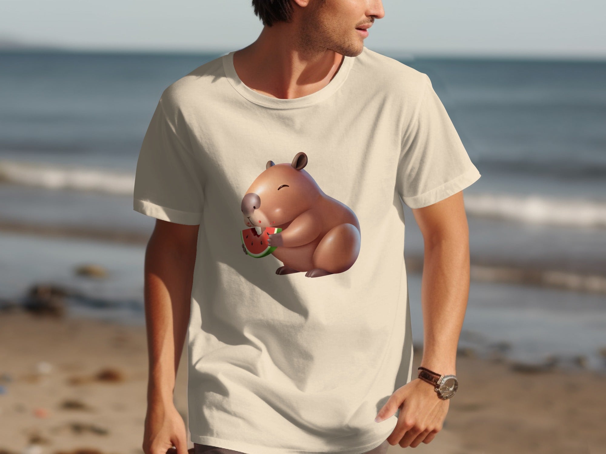 Capybara eating watermelon on a cream t-shirt with a beach background.