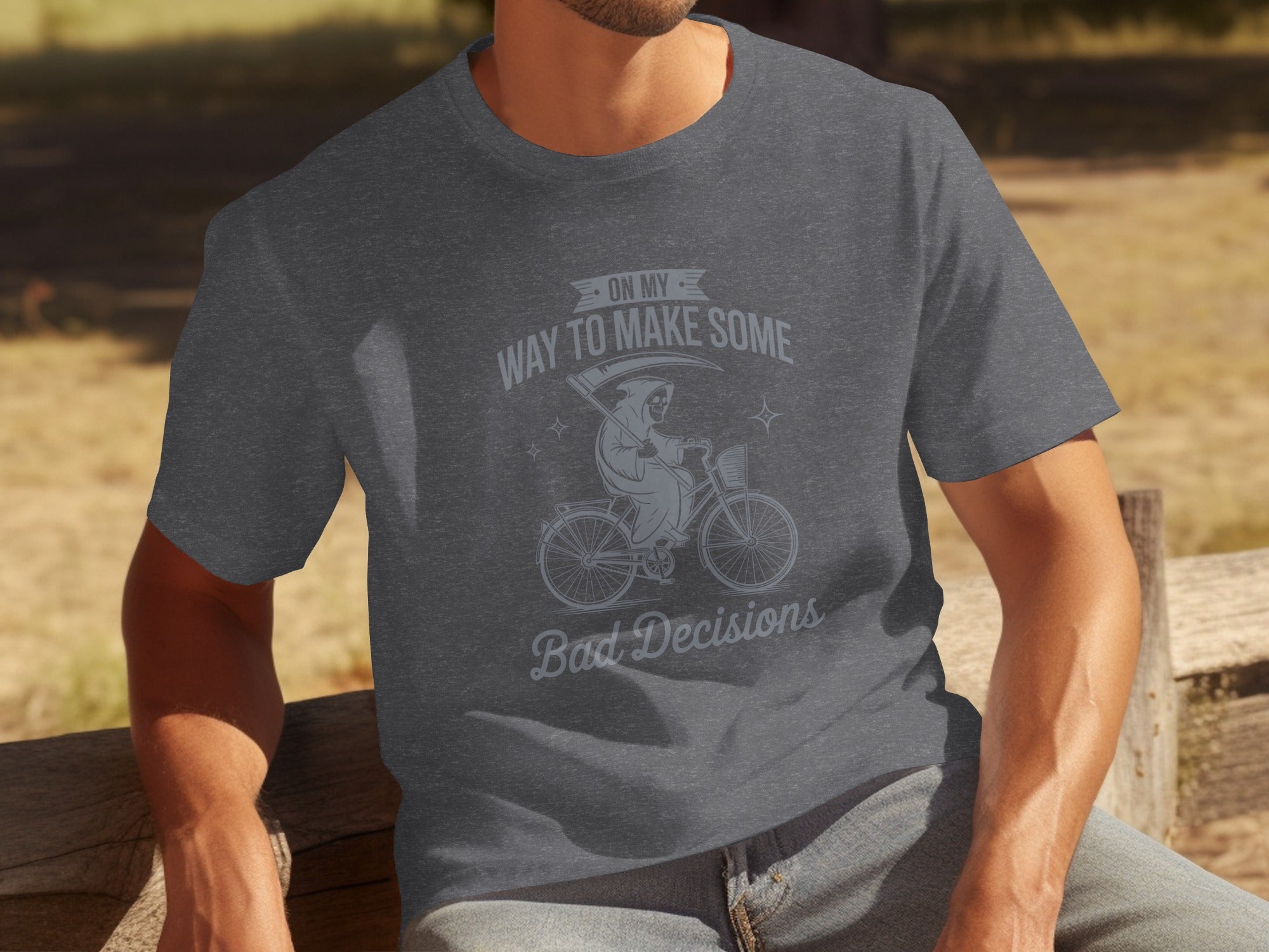 Dark grey t-shirt with Grim Reaper on bicycle graphic and text "On My Way To Make Some Bad Decisions."