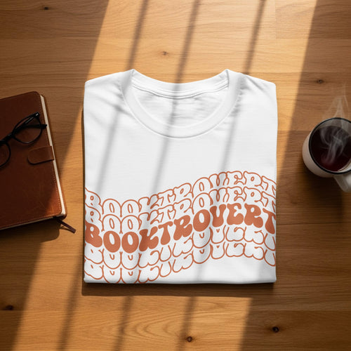 White t-shirt with "Booktrovert" text in a groovy orange font.