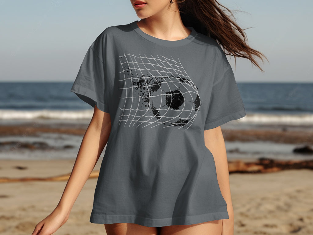 Gray t-shirt with distressed soccer ball breaking through a net graphic.