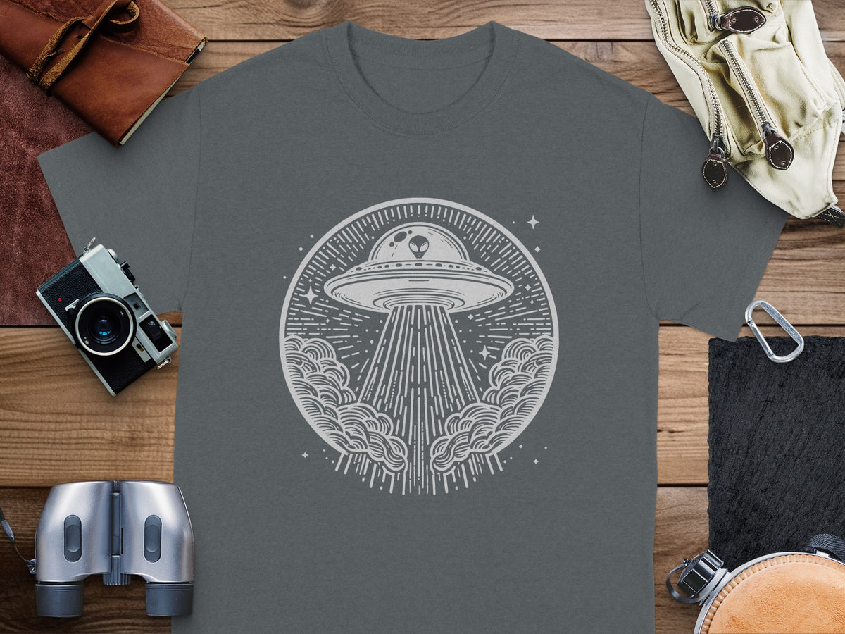 UFO with alien beaming light down from circular cloud design on gray t-shirt.