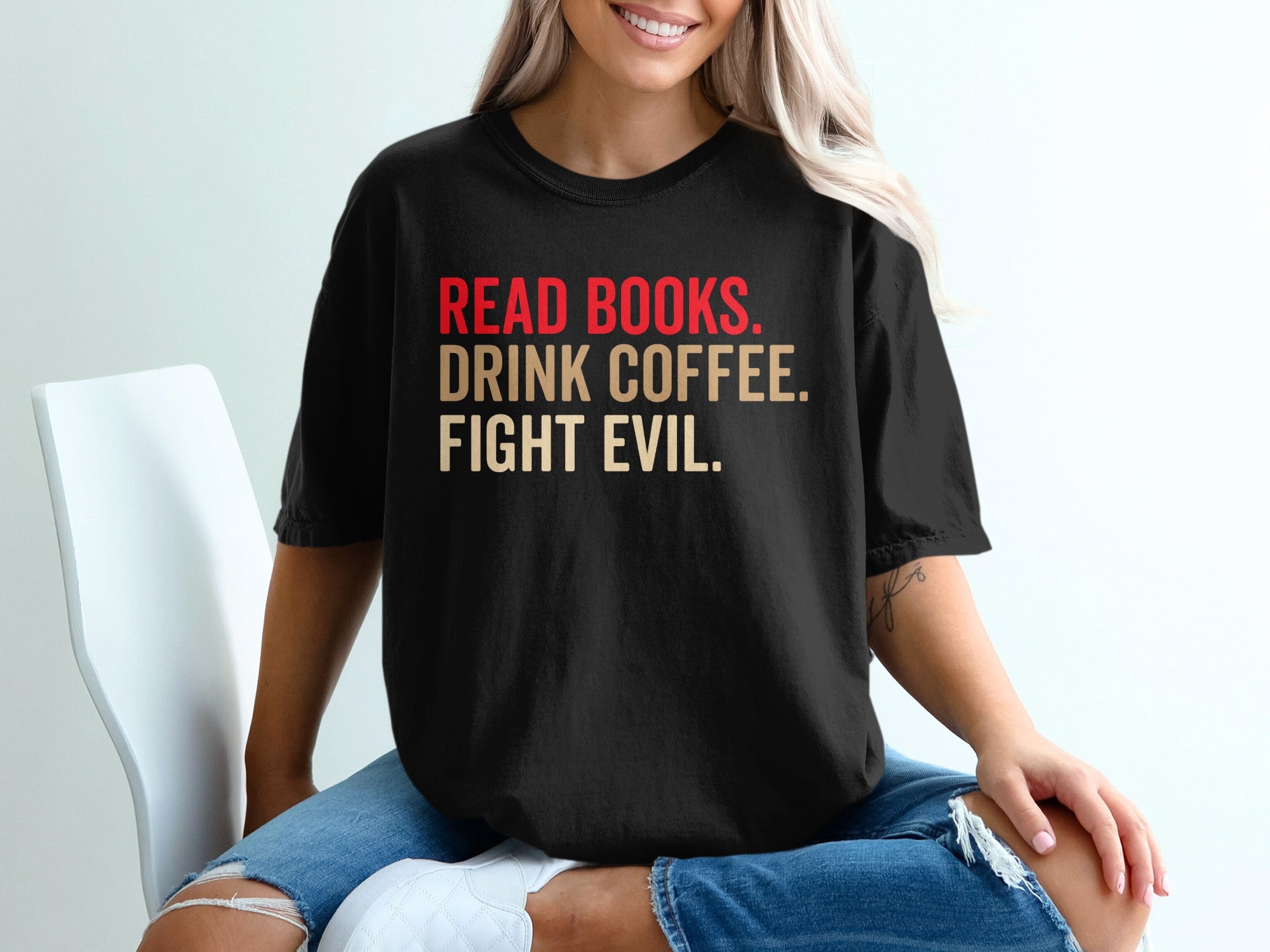 Black t-shirt with red and beige text: Read Books. Drink Coffee. Fight Evil.