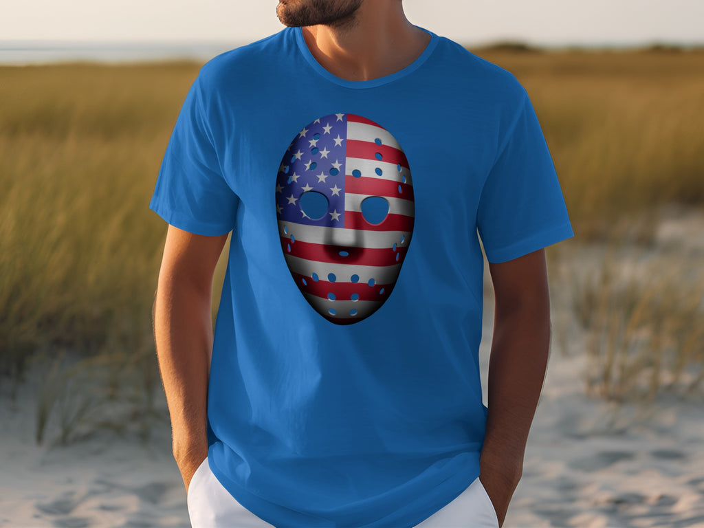 Man wearing a blue t-shirt with an American flag hockey mask graphic.