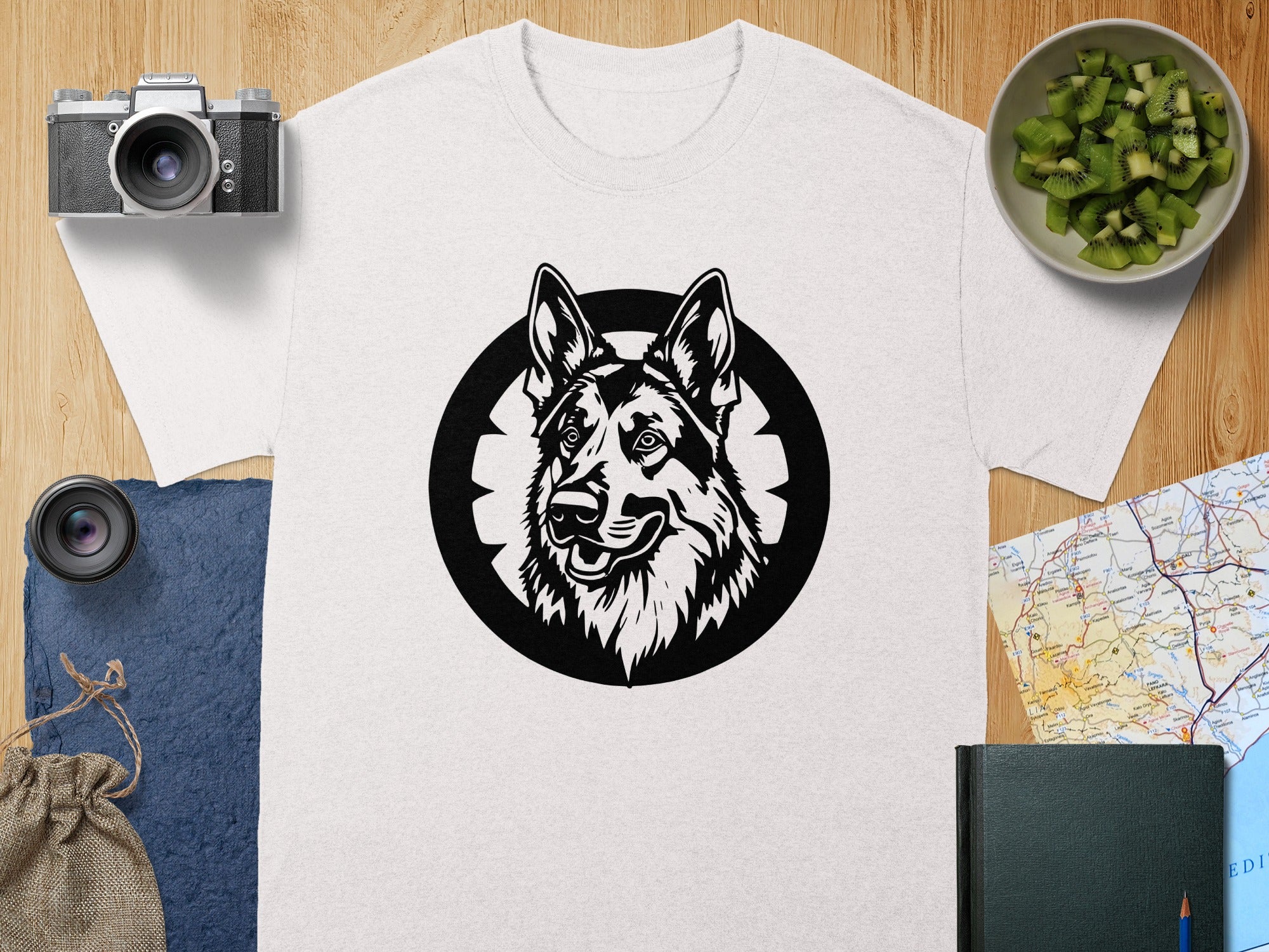 White t-shirt with a black German Shepherd head graphic on a grey textured circle.
