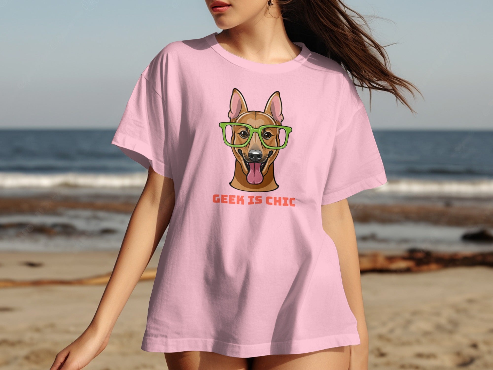 Pink t-shirt with a dog wearing glasses and the text "GEEK IS CHIC".