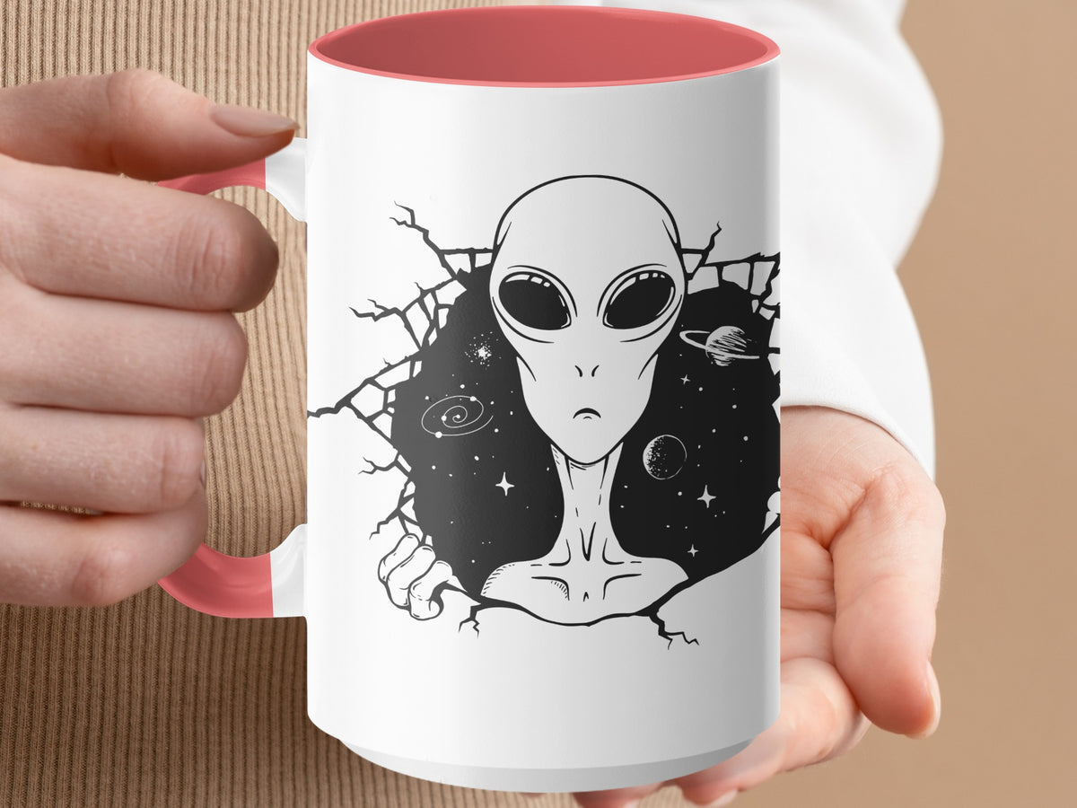 White mug with coral interior, featuring a black alien breaking through space background.
