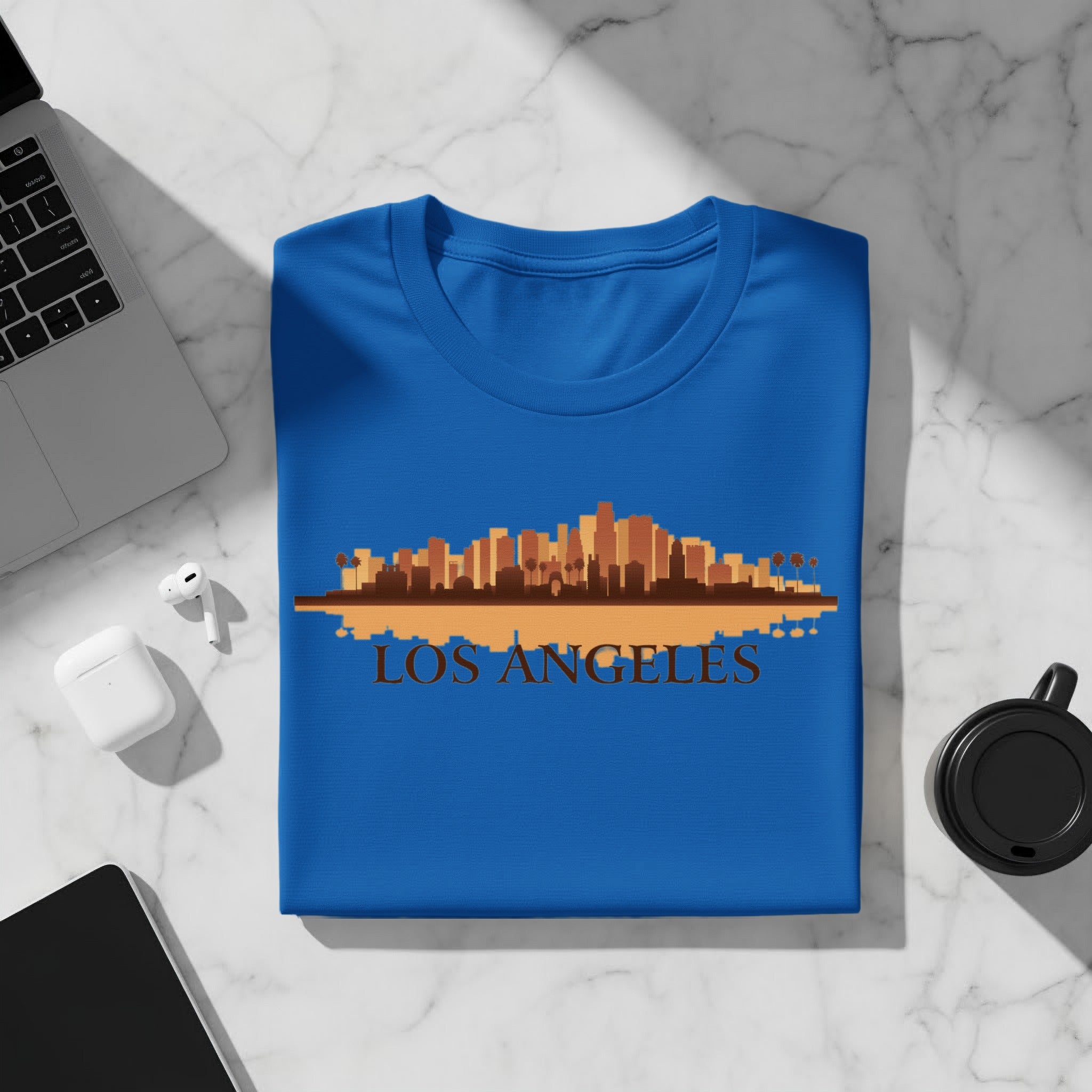 Blue t-shirt with Los Angeles skyline and text graphic.