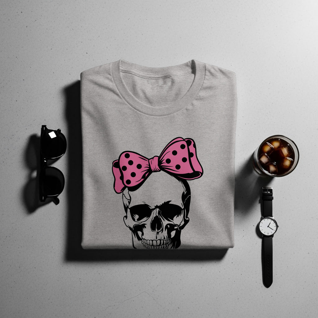 Gray t-shirt with a black and pink polka dot bow on a skull graphic.