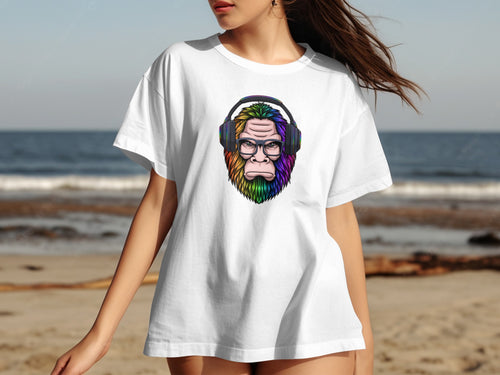 White t-shirt with a colorful Bigfoot illustration wearing headphones and glasses.