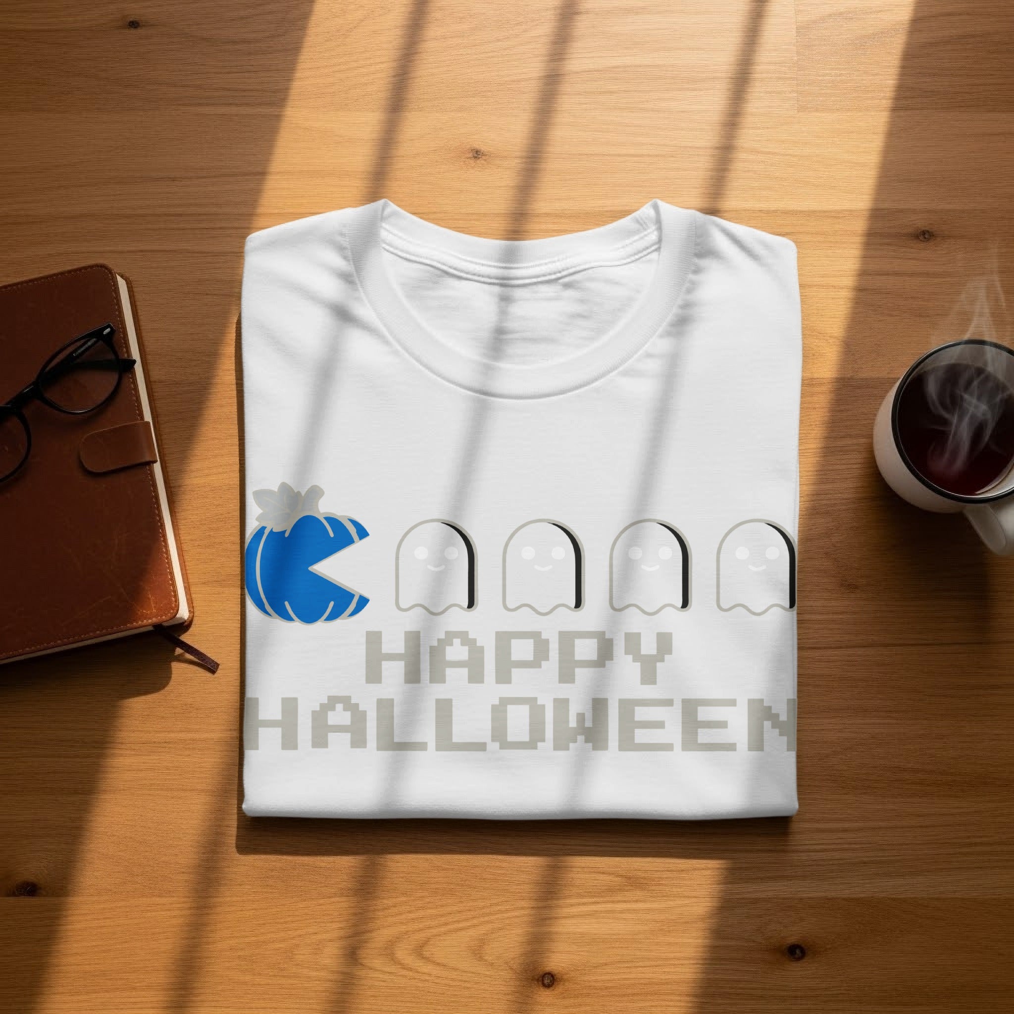 White t-shirt with Pac-Man, ghosts, and "Happy Halloween" text in pixel art.