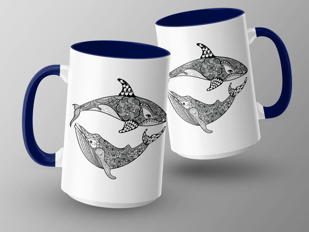 Two white mugs with blue handles feature black line art of whales and orcas with intricate patterns.