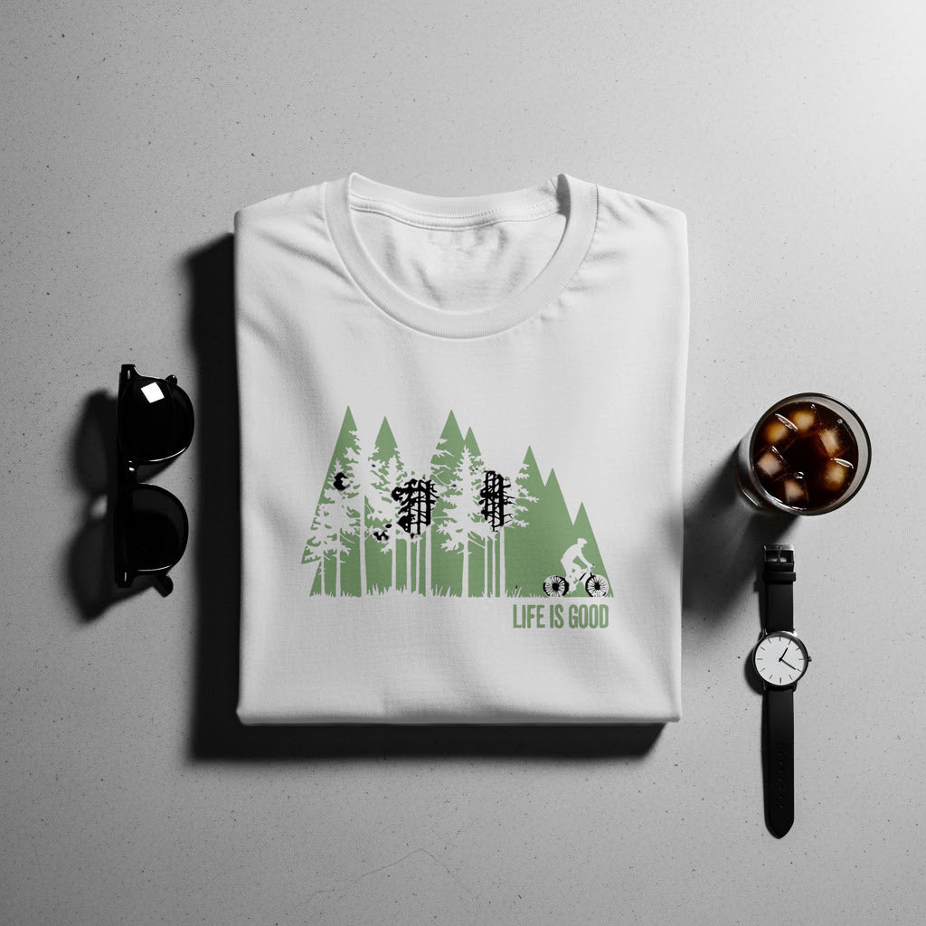 White t-shirt with green forest graphic and "Life is Good" text.