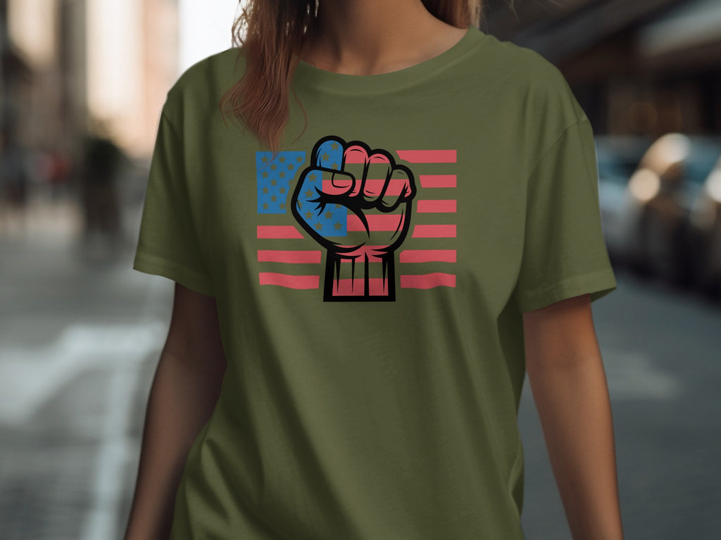 Olive green t-shirt with a graphic of a clenched fist over the American flag.