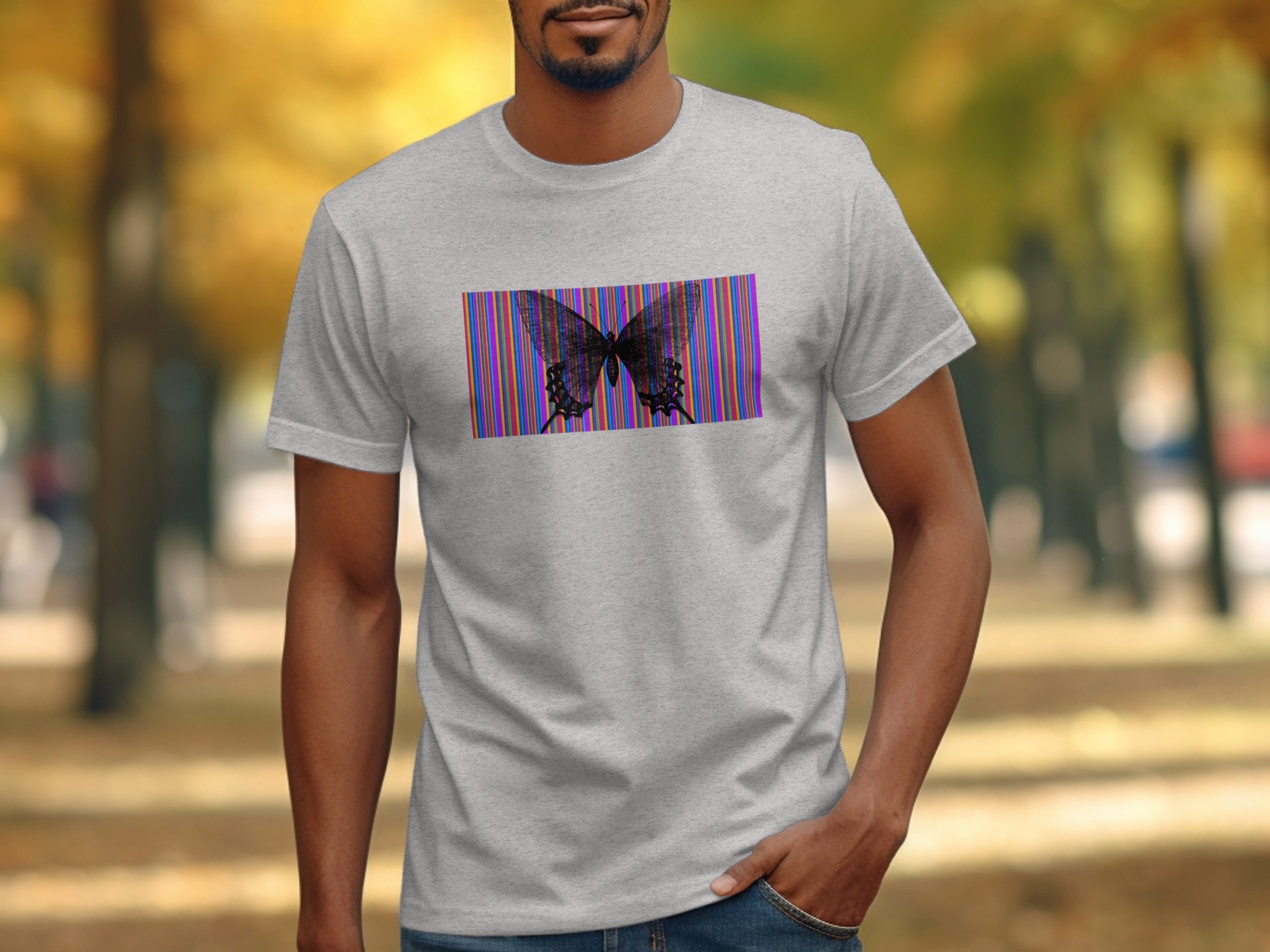 Grey t-shirt with a black butterfly graphic over a colorful striped rectangle.