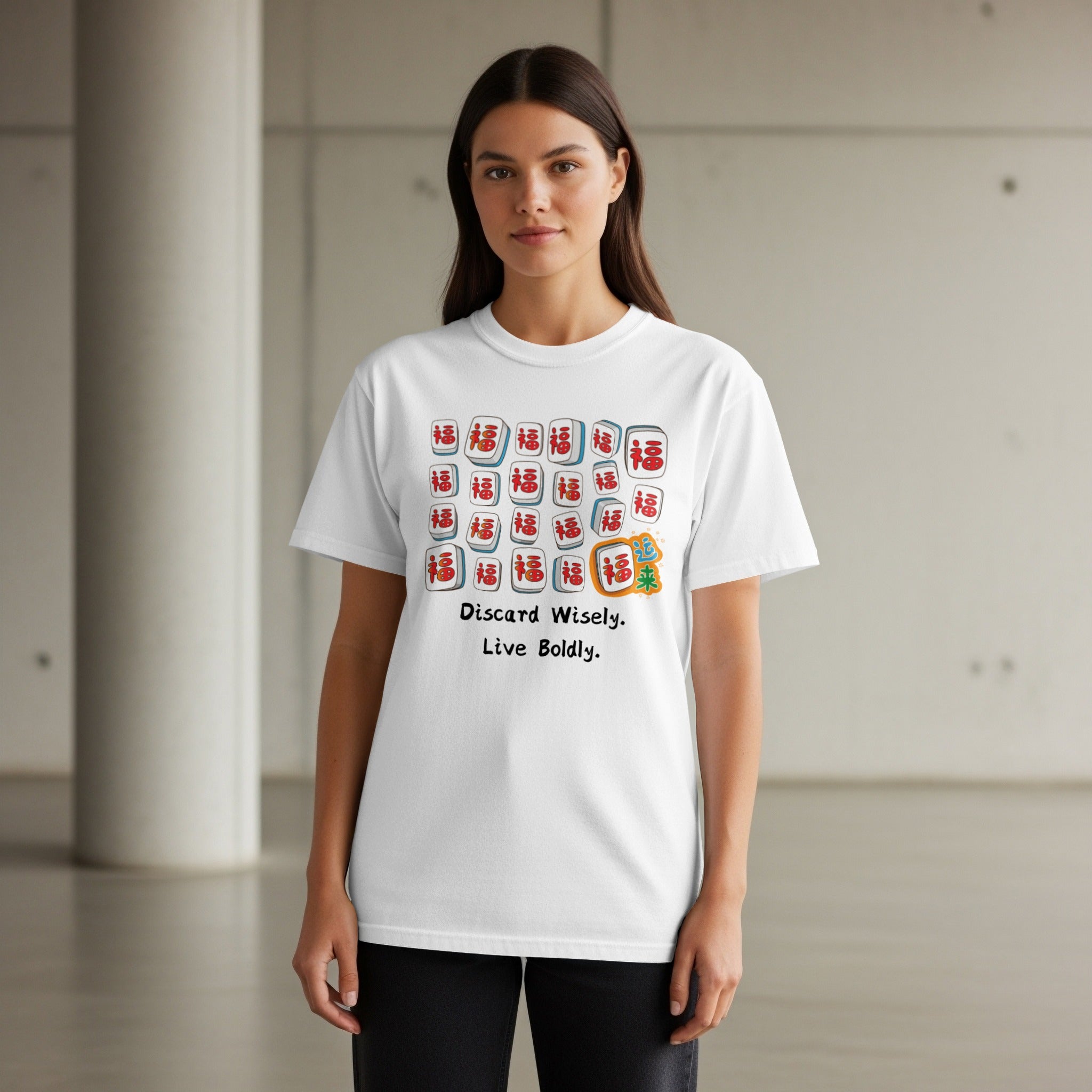 White t-shirt with mahjong tiles and text "Discard Wisely. Live Boldly."